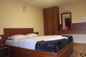 Postel nebo postele na pokoji v ubytování Nook Residency