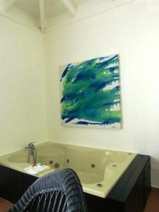 a bathroom with a sink, toilet, and bathtub at Blue JackTar in San Felipe de Puerto Plata