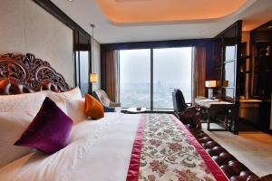 Katil atau katil-katil dalam bilik di Chengdu CYNN Hotel