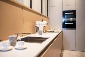Kuchyňa alebo kuchynka v ubytovaní Cinquanta4 Charme Apartment