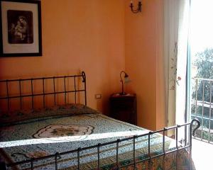 Postel nebo postele na pokoji v ubytování Agriturismo Il Vecchio Casale
