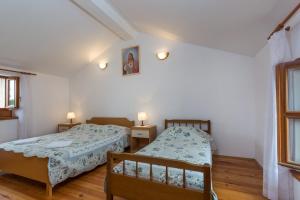 Postel nebo postele na pokoji v ubytování Nilda 2
