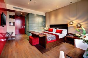 Posteľ alebo postele v izbe v ubytovaní Olivia Plaza Hotel