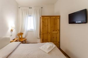 Säng eller sängar i ett rum på Appartamento Continental - 8 posti letto