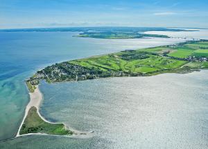 an aerial view of an island in the water at Ferienpark Wulfenerhals in Wulfen auf Fehmarn