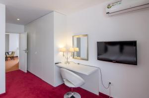 TV a/nebo společenská místnost v ubytování Apart Hotel Vlad Tepes