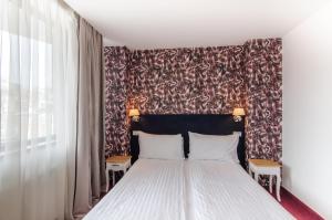 Postel nebo postele na pokoji v ubytování Apart Hotel Vlad Tepes