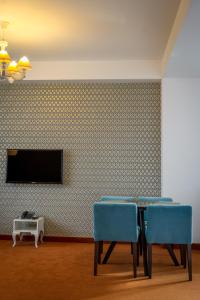 TV a/nebo společenská místnost v ubytování Apart Hotel Vlad Tepes