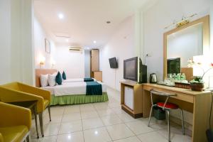 TV a/nebo společenská místnost v ubytování Mariani International Hotel