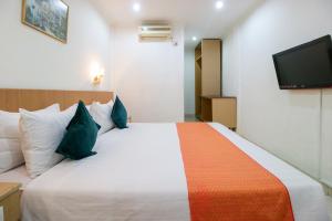 Postel nebo postele na pokoji v ubytování Mariani International Hotel