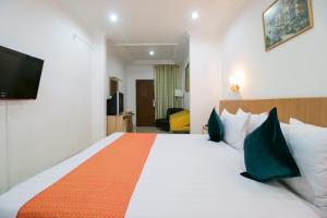 Postel nebo postele na pokoji v ubytování Mariani International Hotel