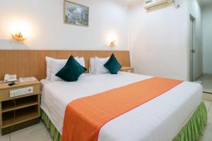 Postel nebo postele na pokoji v ubytování Mariani International Hotel