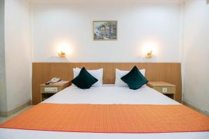 Postel nebo postele na pokoji v ubytování Mariani International Hotel
