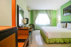 Postel nebo postele na pokoji v ubytování Mariani International Hotel