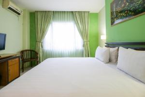 Postel nebo postele na pokoji v ubytování Mariani International Hotel