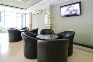 TV a/nebo společenská místnost v ubytování Mariani International Hotel