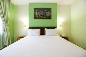 Postel nebo postele na pokoji v ubytování Mariani International Hotel