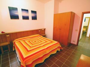 A bed or beds in a room at Residence Il Pavone
