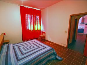 A bed or beds in a room at Residence Il Pavone