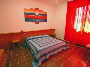 A bed or beds in a room at Residence Il Pavone Még 28 kép