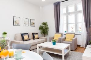 Posezení v ubytování Luxury Main Square Apartments