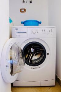 a white washing machine with a bowl on top of it at Dimora San Vito in Monopoli +54 photos