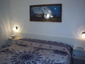 Łóżko lub łóżka w pokoju w obiekcie Le Palme Garden
