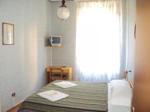 Säng eller sängar i ett rum på Hotel La Salsesina