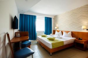 Postel nebo postele na pokoji v ubytování Hotel Apollo