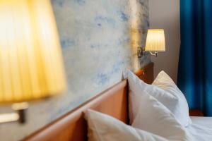 Postel nebo postele na pokoji v ubytování Hotel Apollo