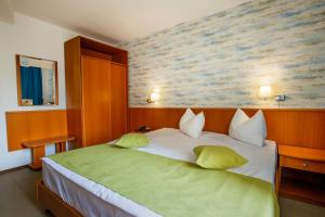 Postel nebo postele na pokoji v ubytování Hotel Apollo