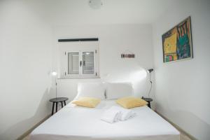 Ein Bett oder Betten in einem Zimmer der Unterkunft Apartments Emotha