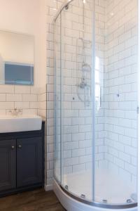 a bathroom with a shower and a sink at The Saracens Head in Stafford