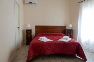 Säng eller sängar i ett rum på Alloggio della Posta Vecchia