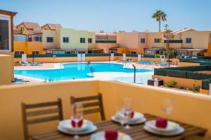 a view of a swimming pool from a hotel balcony at Apartment Delfines Sand Corralejo By Holidays Home in Corralejo