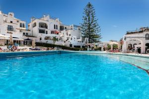 The swimming pool at or close to weforyou near the beach TWO bedrooms in Pueblo Evita