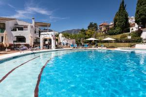 The swimming pool at or close to weforyou near the beach TWO bedrooms in Pueblo Evita