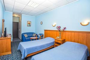 Łóżko lub łóżka w pokoju w obiekcie Ivushka Health Resort