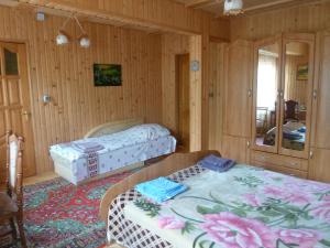 A bed or beds in a room at U Olgi