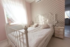 Posteľ alebo postele v izbe v ubytovaní Villa Harmónia
