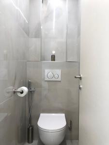 a bathroom with a white toilet in a stall at Monte Carlo View in Cap d'Ail