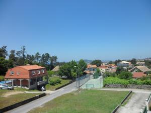 arial view of a house in a residential neighborhood at Hostal Alce in Nigrán +27 photos