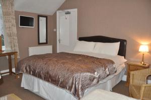 Łóżko lub łóżka w pokoju w obiekcie Walcot House