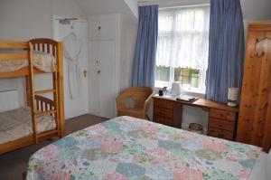 Łóżko lub łóżka w pokoju w obiekcie Walcot House