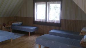 A bed or beds in a room at Järvesilma Tourism Farm