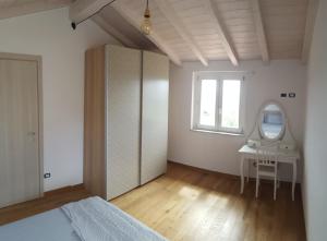 Postel nebo postele na pokoji v ubytování Casa Vacanza Alba