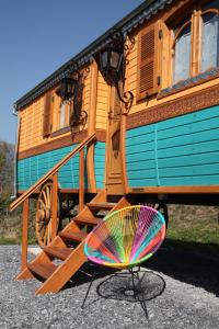 a colorful fan sitting in front of a train at Roulottes Montagne Pyrenees in Luz-Saint-Sauveur