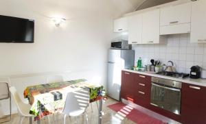 A kitchen or kitchenette at Between Termini & Colosseo