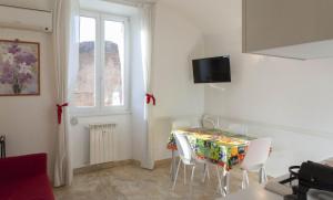 A television and/or entertainment centre at Between Termini & Colosseo