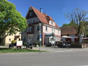 
a small town with a large brick building on the side of the road at Eichamt in Sigmaringen
